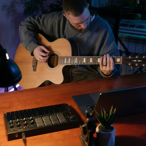 Close-up of hands playing lead on an electric guitar during an online lesson